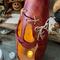 This shows the spooky detail of the pumpkin. It has scares across his face that have been stitched up with hemp cord. 